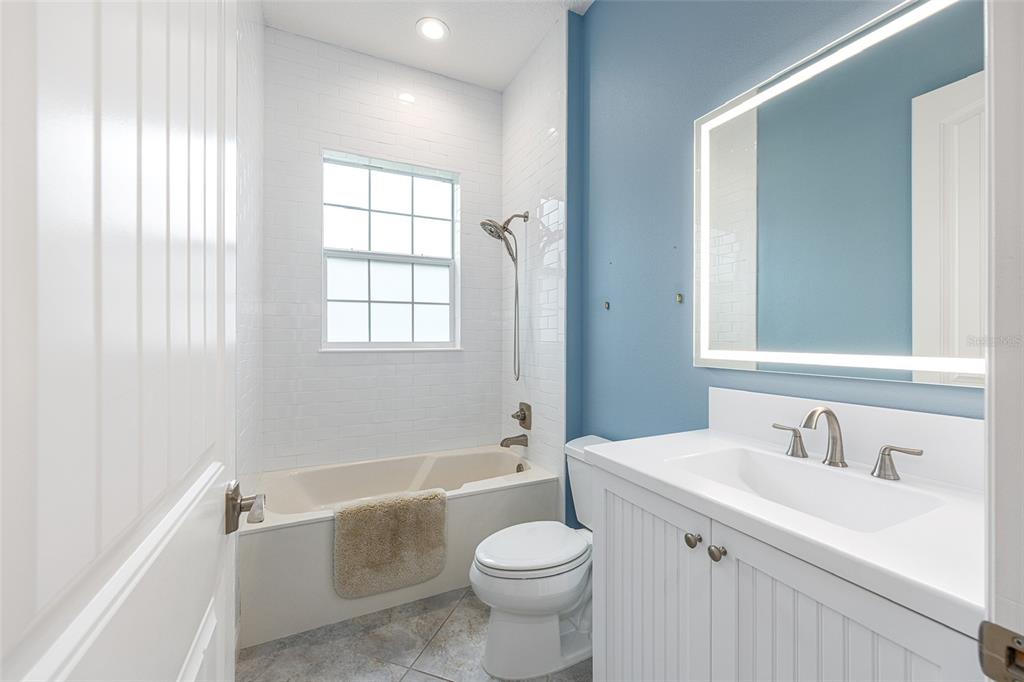 8671 Southwest 83rd Loop Ocala, FL 34481 - Photo 42 of 58 a bathroom with a sink toilet tub and shower