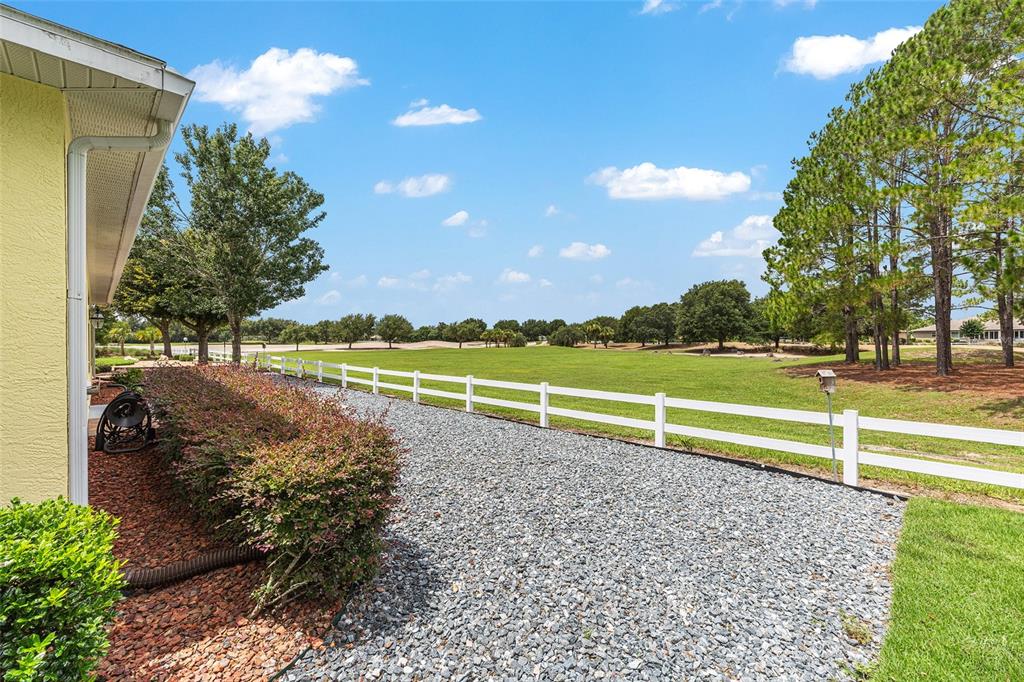 8671 Southwest 83rd Loop Ocala, FL 34481 - Photo 53 of 58 a view of a golf course with a lake