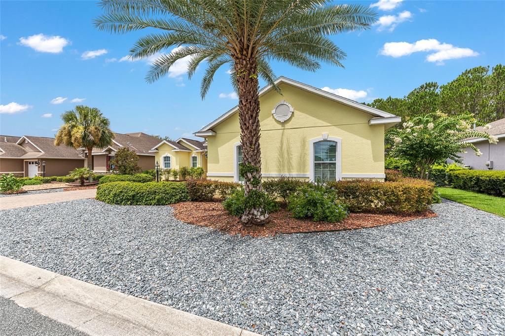 8671 Southwest 83rd Loop Ocala, FL 34481 - Photo 55 of 58 a front view of a house with garden