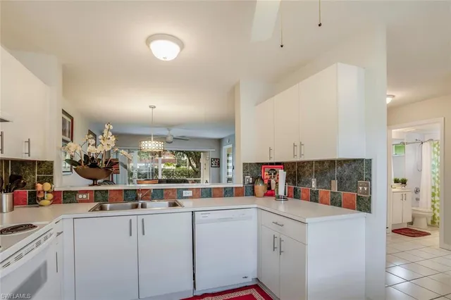 a kitchen with counter top space and cabinets
