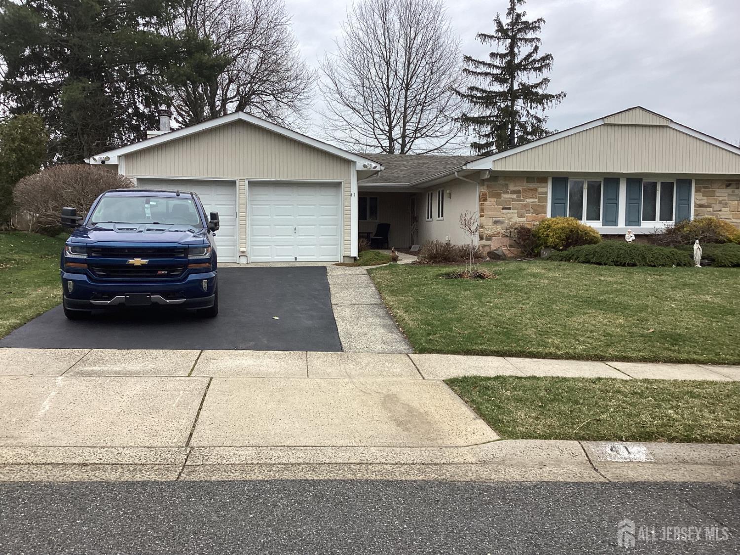 41 Faith Lane Matawan, NJ 07747 - Photo 1 of 24 a car parked in front of a house