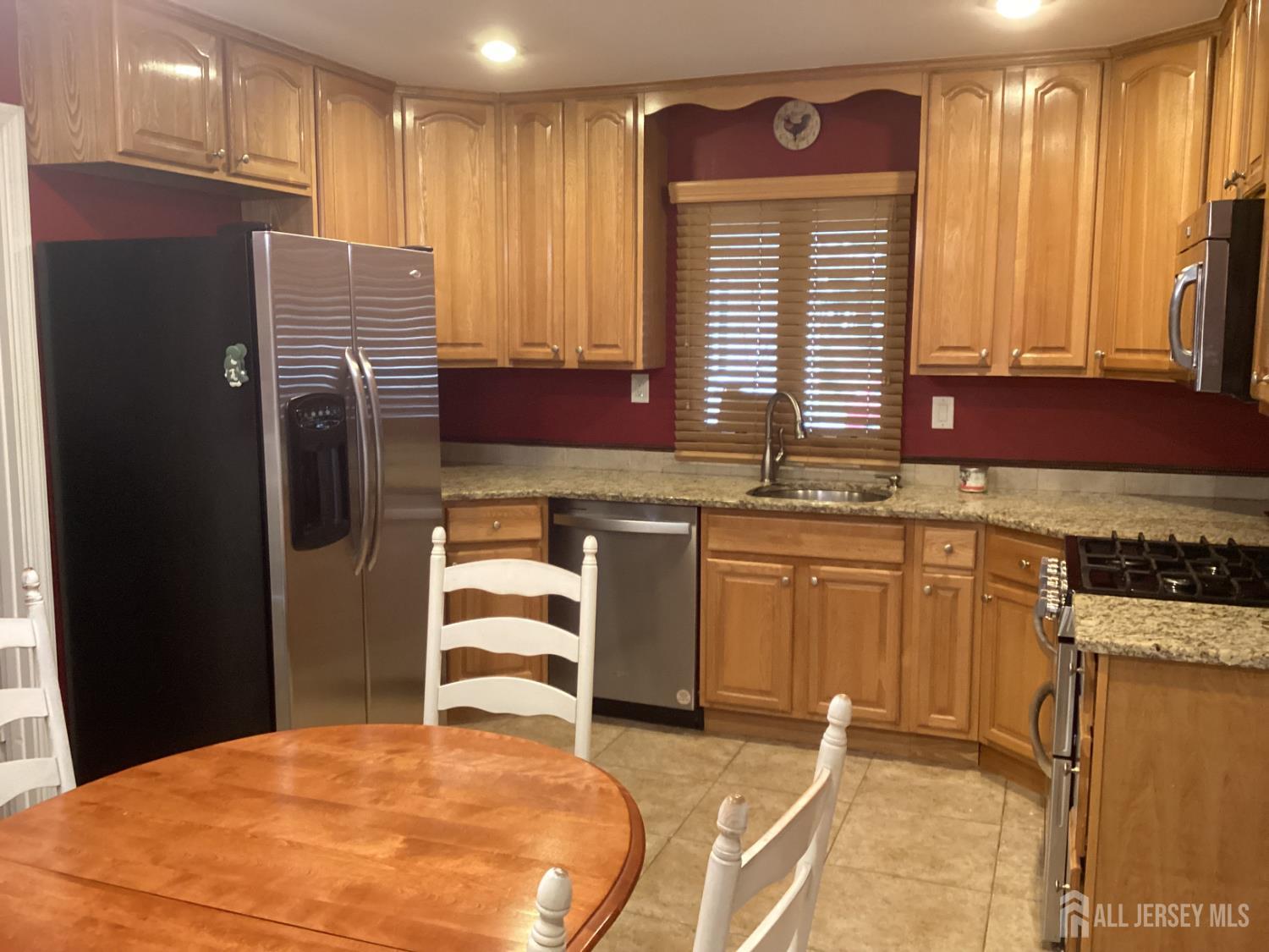 41 Faith Lane Matawan, NJ 07747 - Photo 15 of 24 a kitchen with stainless steel appliances granite countertop a refrigerator and a sink
