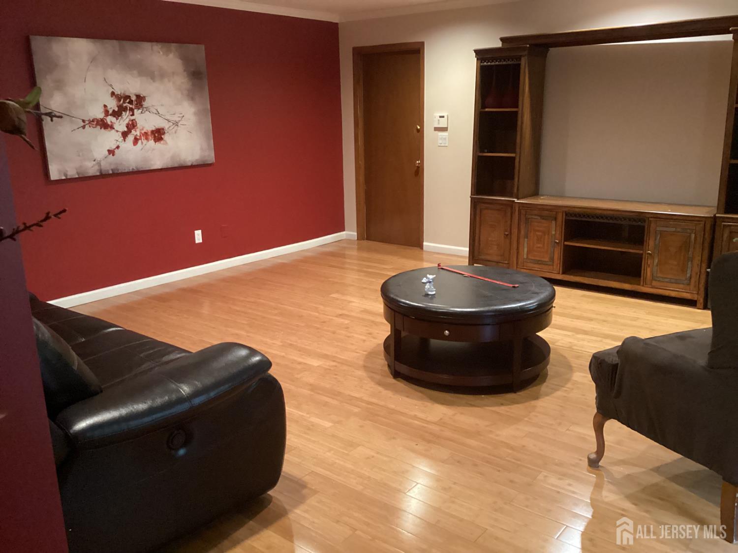 41 Faith Lane Matawan, NJ 07747 - Photo 17 of 24 a living room with furniture and a air conditioner vent