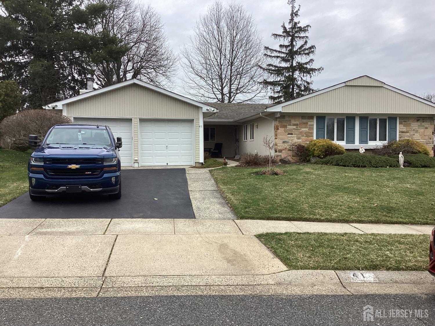 41 Faith Lane Matawan, NJ 07747 - Photo 2 of 24 a front view of a house with a yard