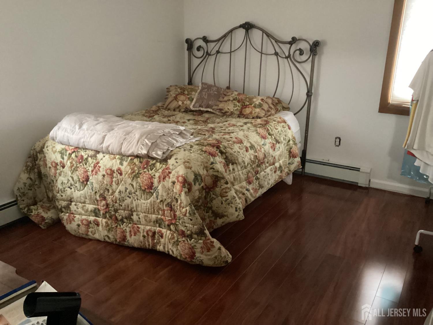 41 Faith Lane Matawan, NJ 07747 - Photo 23 of 24 a bed sitting in a bedroom next to a window