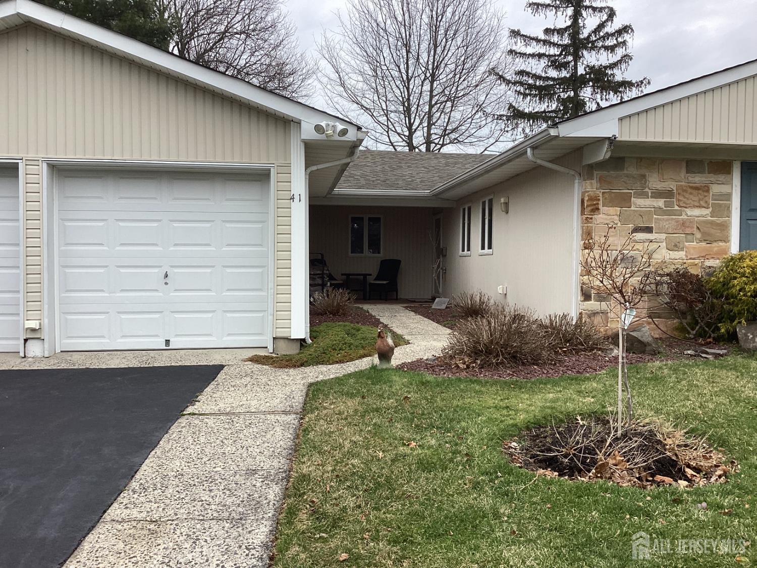 41 Faith Lane Matawan, NJ 07747 - Photo 3 of 24 a front view of a house with garden
