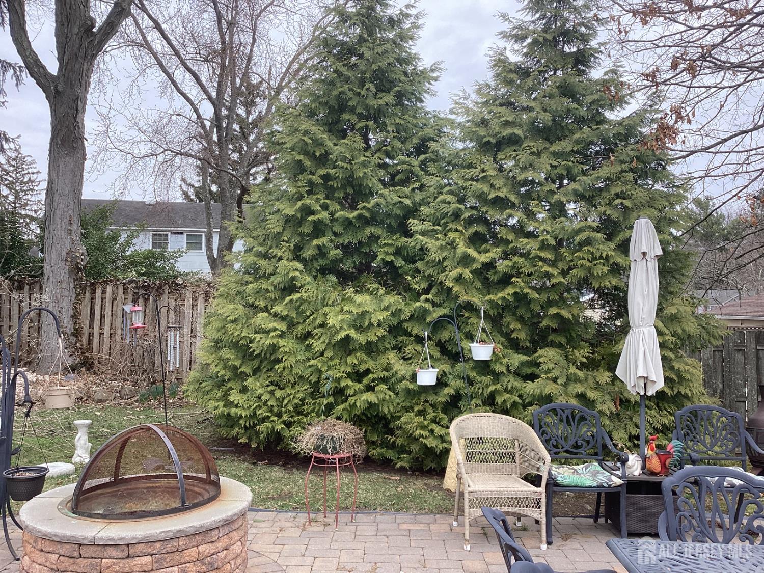 41 Faith Lane Matawan, NJ 07747 - Photo 5 of 24 a view of a chairs and table in backyard