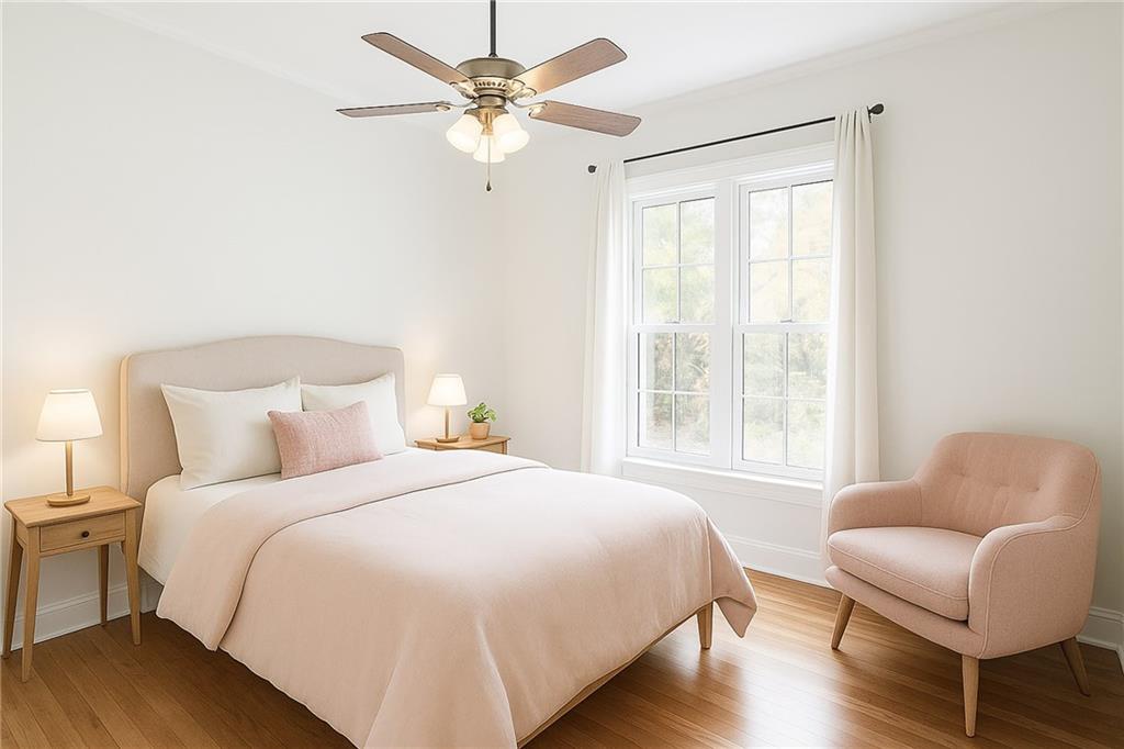 14440 Cogburn Road Alpharetta, GA 30004 - Photo 24 of 62 a bedroom with a bed and a couch