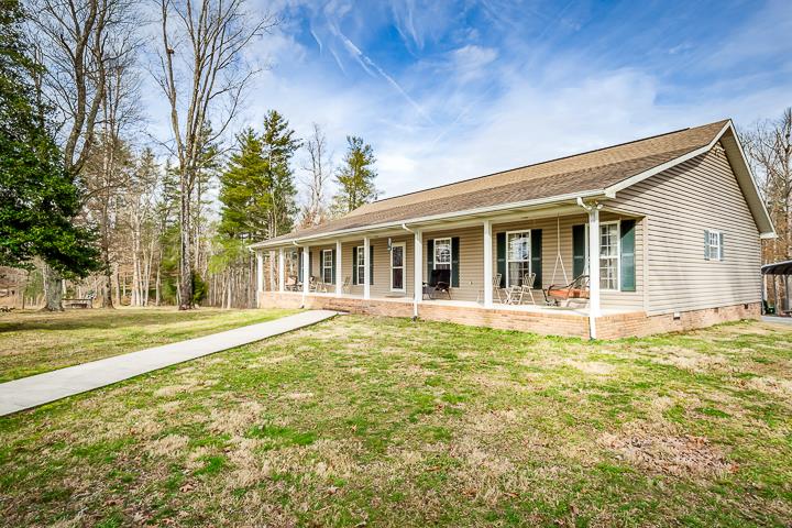 2329 Roslin Road Jamestown, TN 38556 - Photo 1 of 30 a view of a house with a backyard and a tree