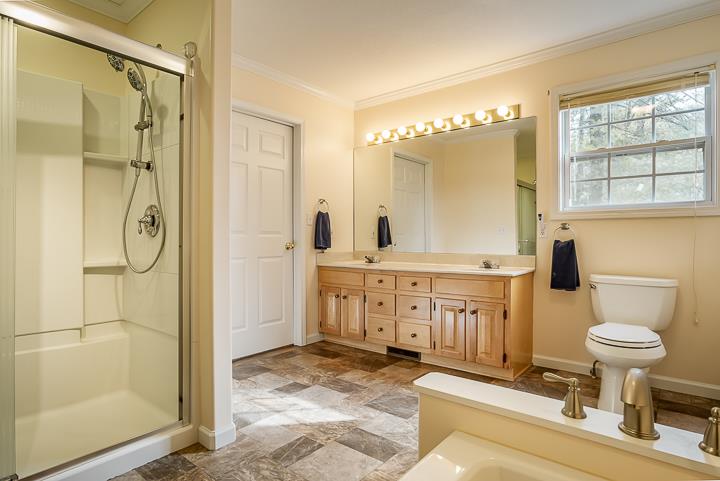2329 Roslin Road Jamestown, TN 38556 - Photo 14 of 30 a bathroom with a sink a toilet and shower
