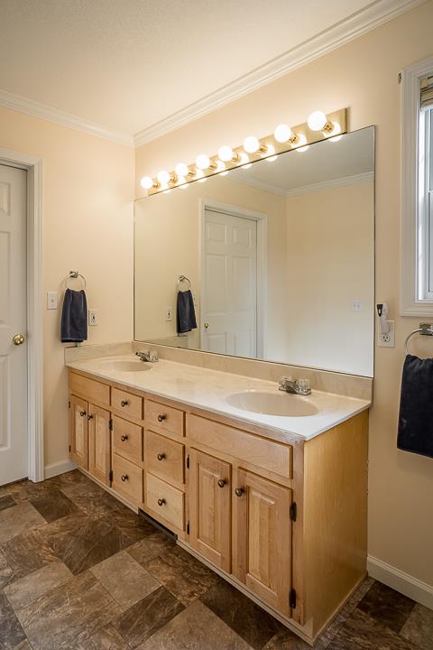 2329 Roslin Road Jamestown, TN 38556 - Photo 16 of 30 a bathroom with a sink and a mirror