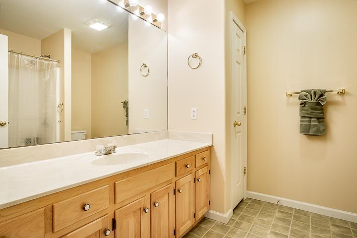 2329 Roslin Road Jamestown, TN 38556 - Photo 21 of 30 a bathroom with a shower sink and mirror