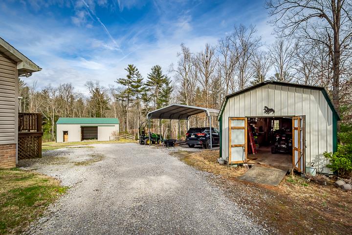 2329 Roslin Road Jamestown, TN 38556 - Photo 26 of 30 a view of a house with a patio and a yard