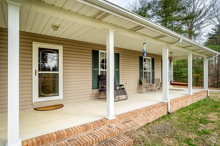 2329 Roslin Road Jamestown, TN 38556 - Photo 3 of 30 a view of a chair and tables in the balcony