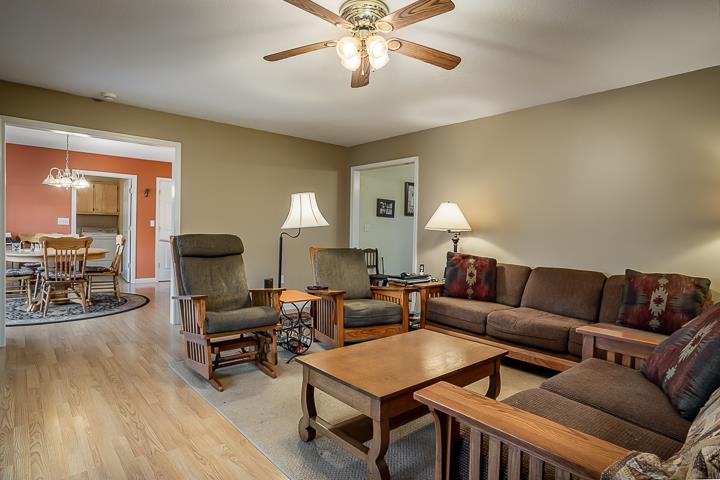 2329 Roslin Road Jamestown, TN 38556 - Photo 7 of 30 a living room with furniture a fireplace and a chandelier
