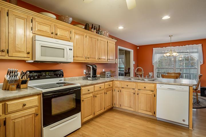 2329 Roslin Road Jamestown, TN 38556 - Photo 10 of 30 a kitchen with stainless steel appliances granite countertop a stove sink and cabinets