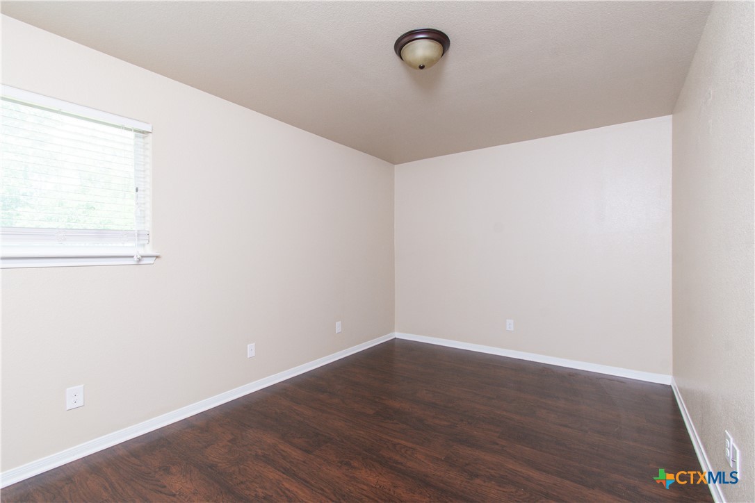 1102 Grace Point Drive, Unit A Killeen, TX 76549 - Photo 11 of 18 a view of a small space with wooden floor