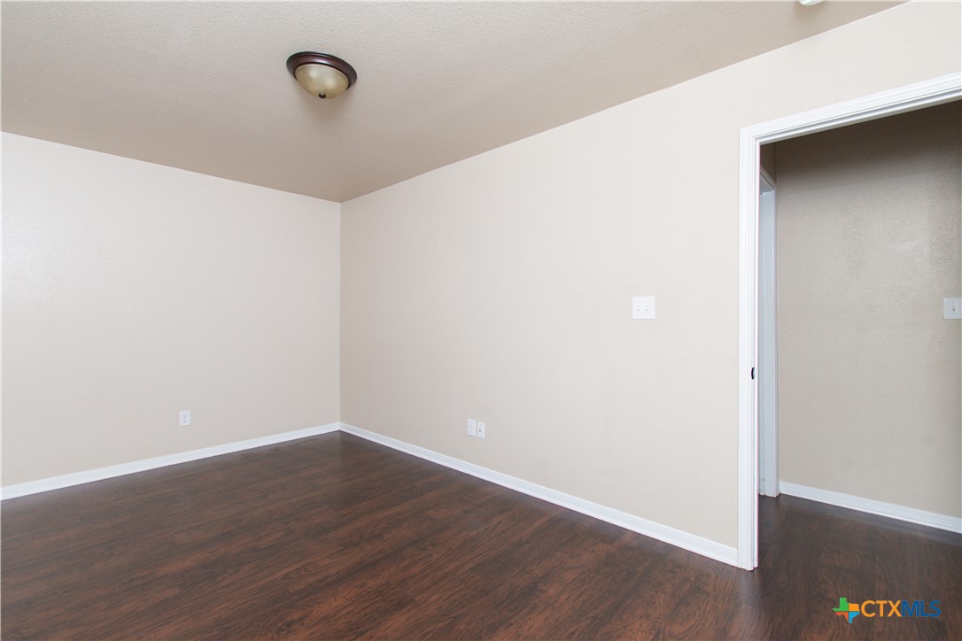 1102 Grace Point Drive, Unit A Killeen, TX 76549 - Photo 12 of 18 a view of a room with wooden floor