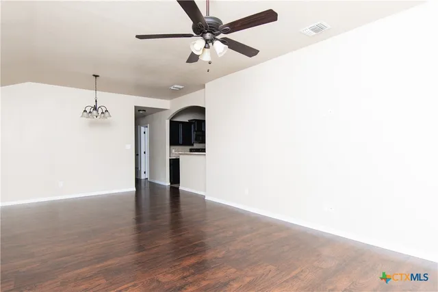 a view of a kitchen with a microwave and a ceiling fan