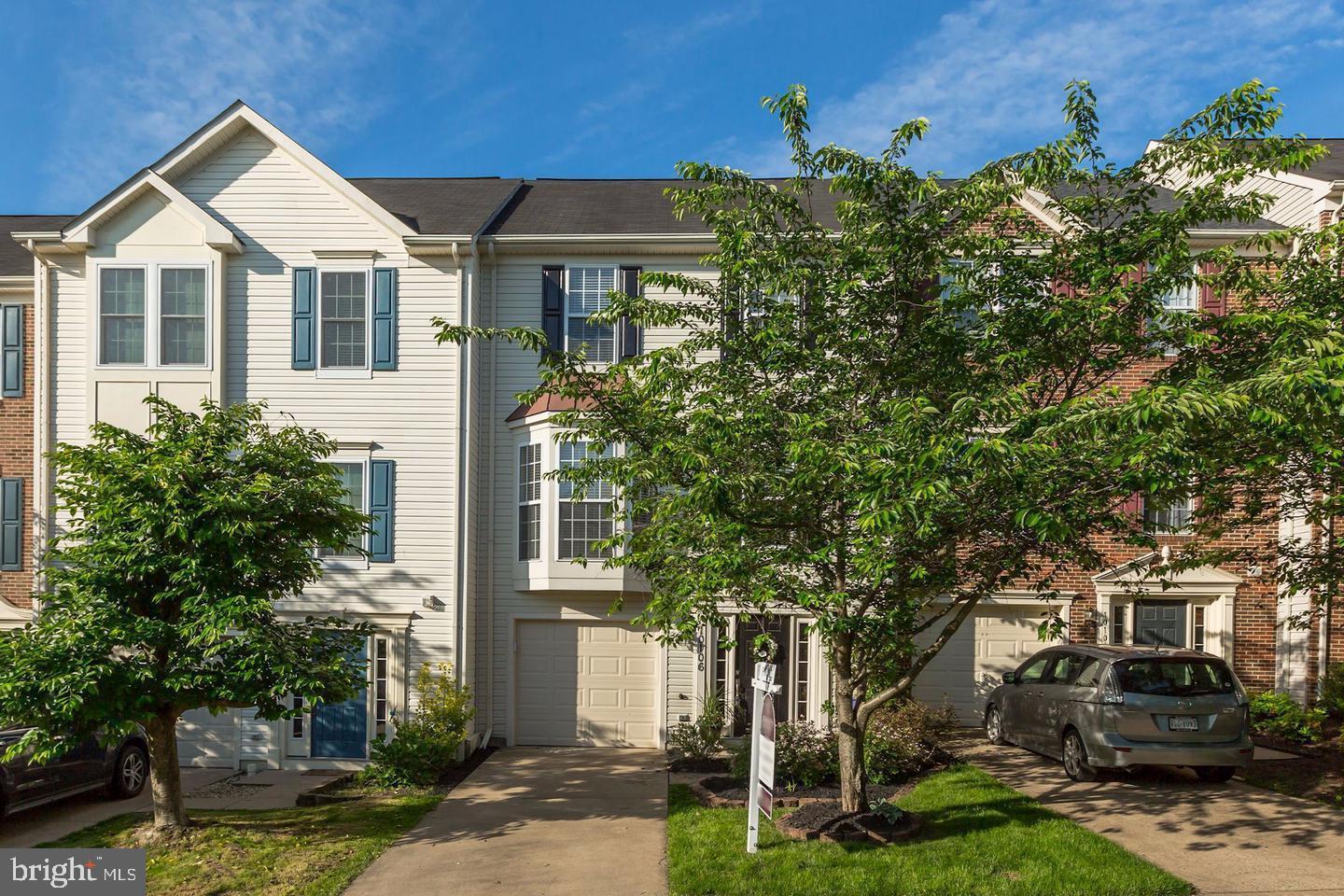 10106 Sir Reynard Lane Bristow, VA 20136 - Photo 1 of 28 front view of a house with a yard