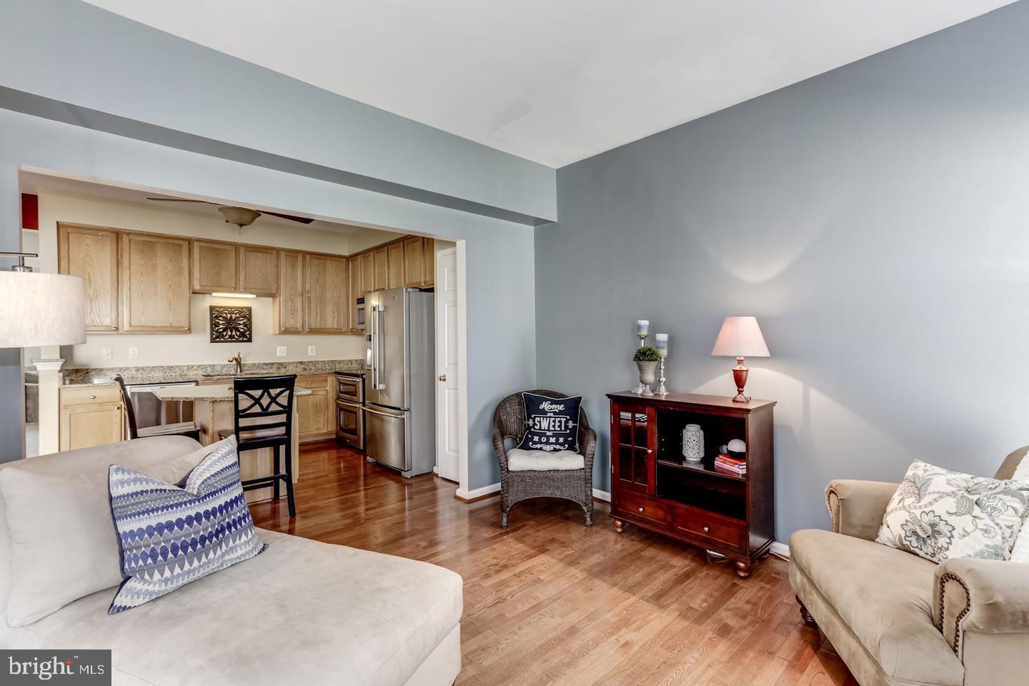 10106 Sir Reynard Lane Bristow, VA 20136 - Photo 11 of 28 a living room with furniture and a fireplace