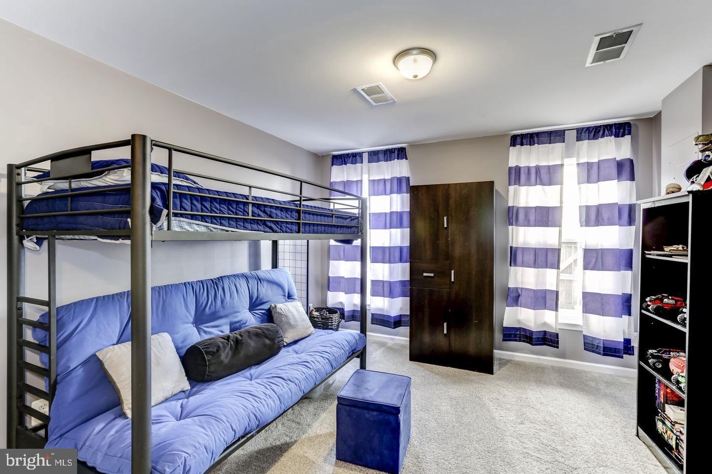10106 Sir Reynard Lane Bristow, VA 20136 - Photo 20 of 28 a living room with furniture and a cabinet
