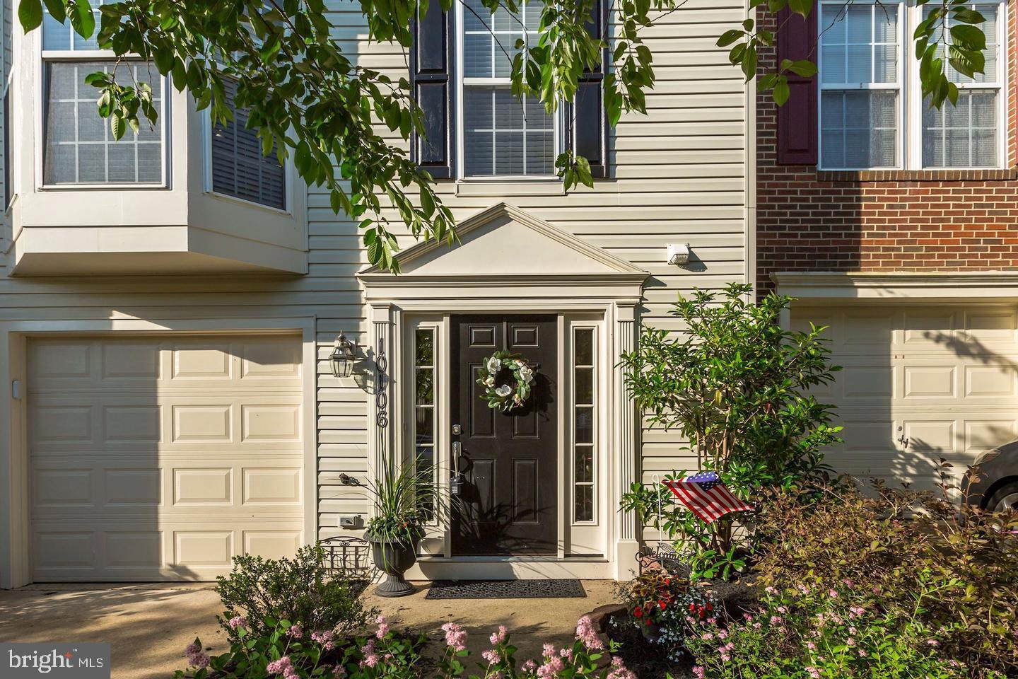 10106 Sir Reynard Lane Bristow, VA 20136 - Photo 2 of 28 a front view of a house with a garden