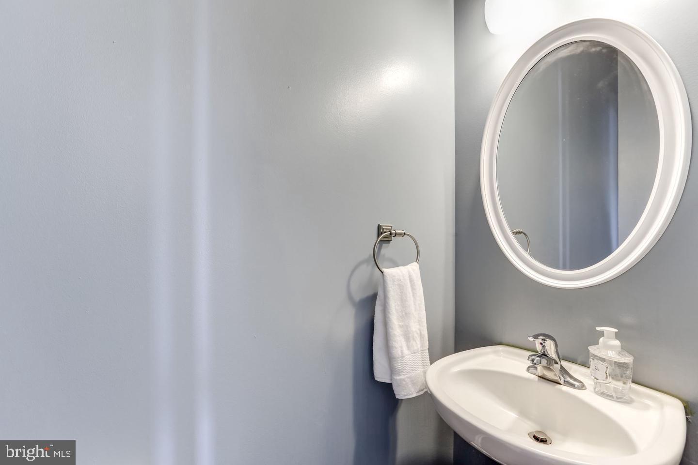 10106 Sir Reynard Lane Bristow, VA 20136 - Photo 21 of 28 a bathroom with a sink and a mirror
