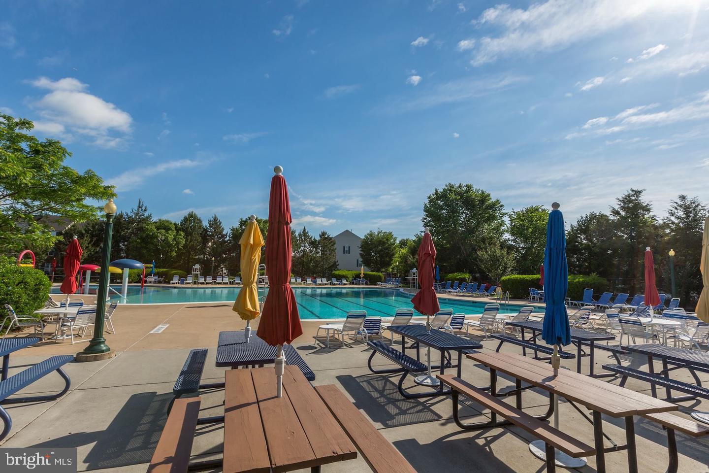 10106 Sir Reynard Lane Bristow, VA 20136 - Photo 27 of 28 a view of a patio with a table and chairs