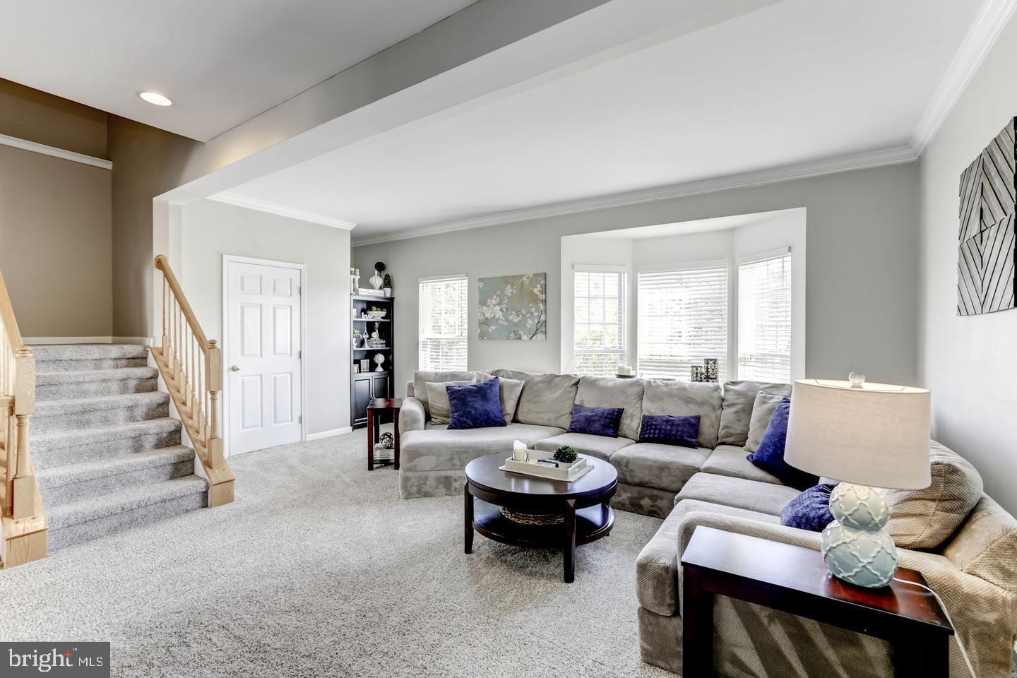 10106 Sir Reynard Lane Bristow, VA 20136 - Photo 5 of 28 a living room with furniture and a large window