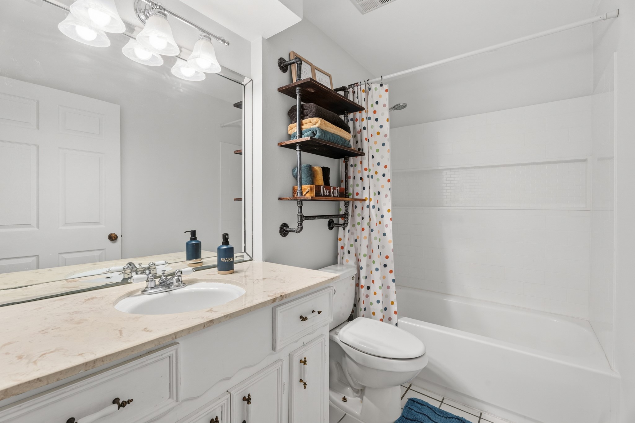 2104 Rose Road Pearland, TX 77581 - Photo 29 of 43 a bathroom with a sink a toilet and shower