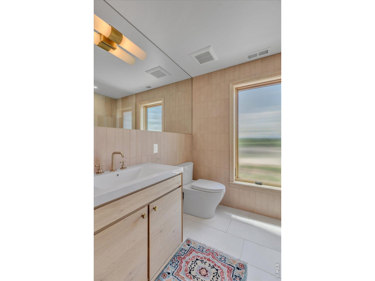 9773 Phillips Road Lafayette, CO 80026 - Photo 26 of 46 a bathroom with a sink and a toilet