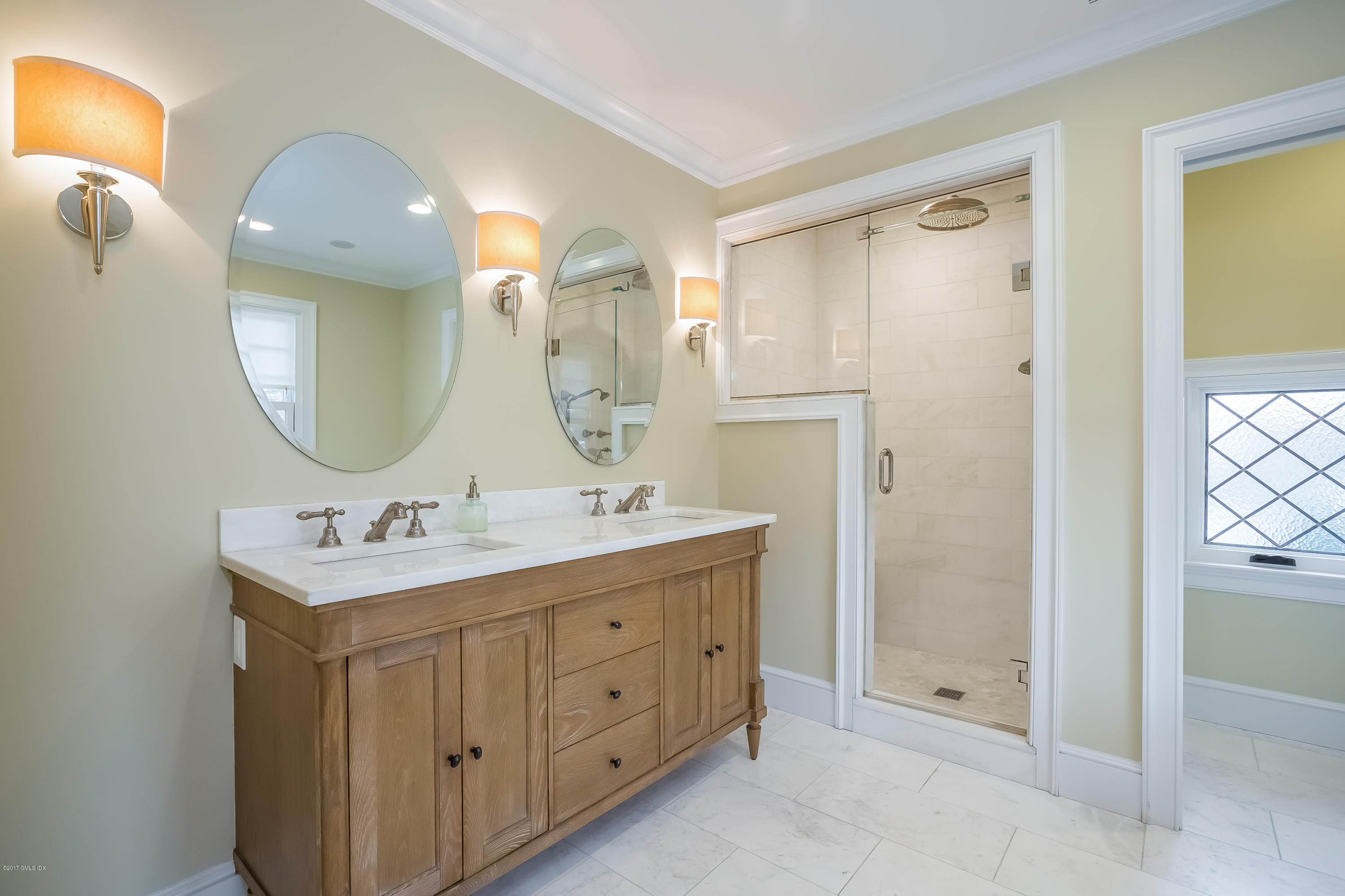 39 Edgewater Drive Old Greenwich, CT 06870 - Photo 8 of 19 a bathroom with a double vanity sink mirror and shower