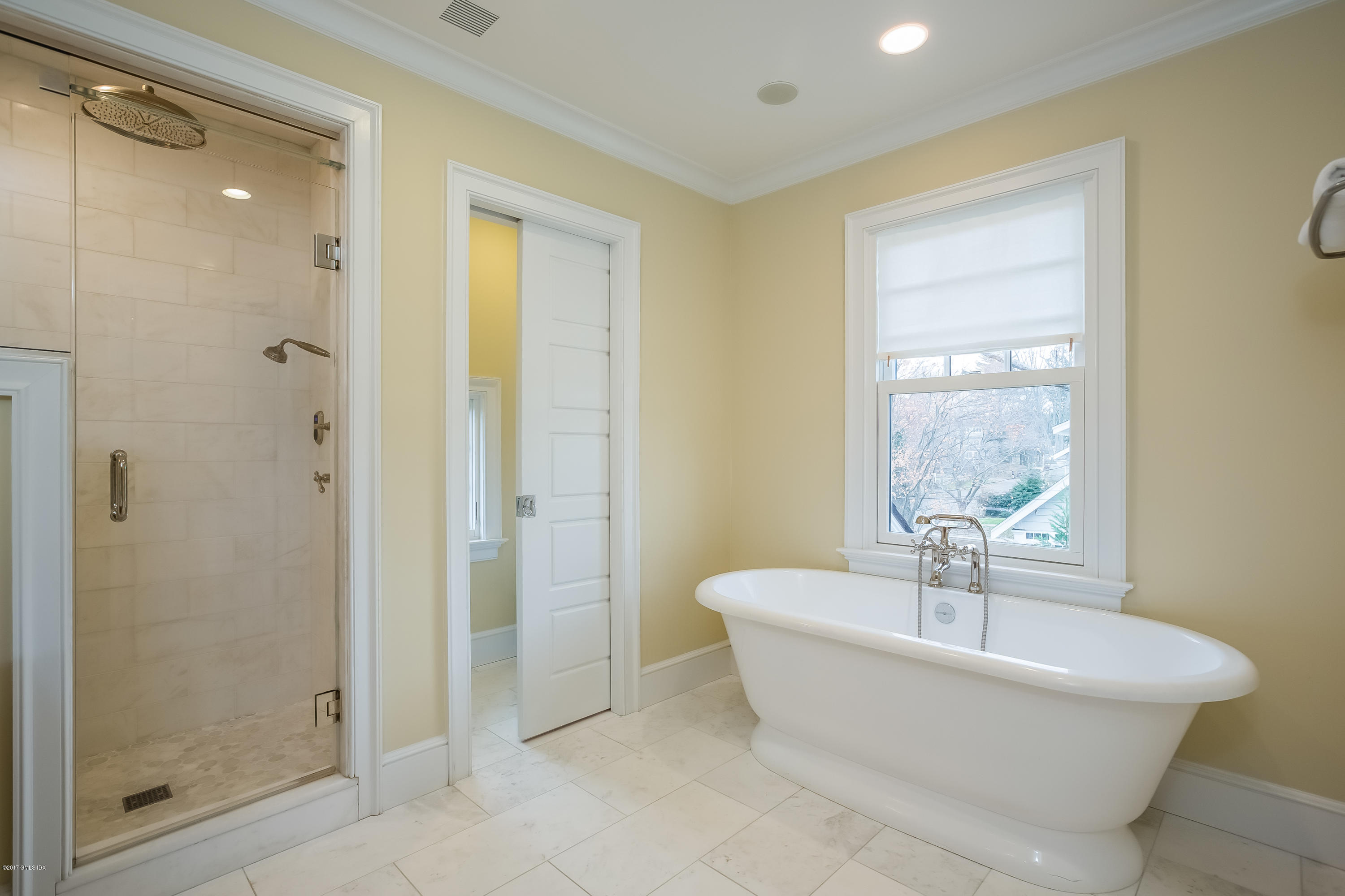39 Edgewater Drive Old Greenwich, CT 06870 - Photo 9 of 19 a bathroom with a bathtub and shower