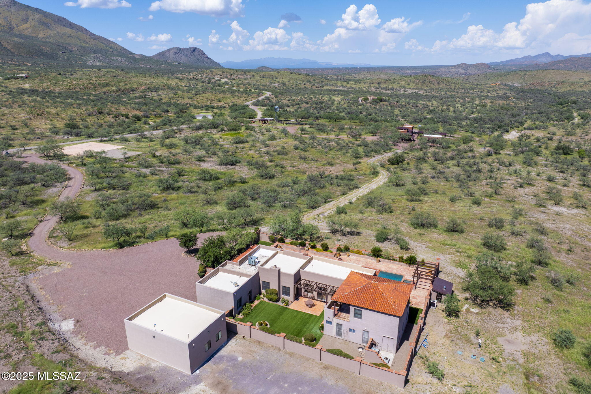 1265 Morning Star Drive Rio Rico, AZ 85648 - Photo 47 of 50 an aerial view of a house with a yard