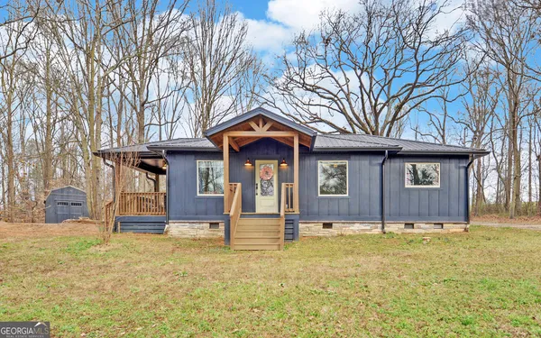 a front view of a house with garden