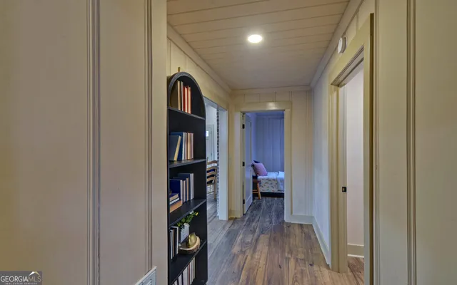 a view of a bedroom with a furniture and closet