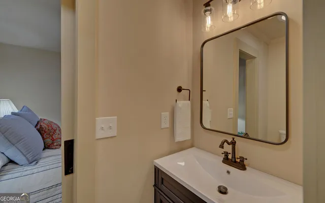 a bathroom with a sink and a mirror