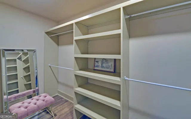 a view of an empty walk in closet