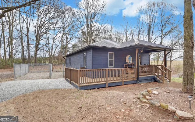 a view of backyard with large trees