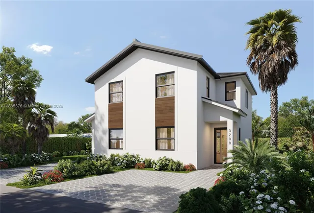 a front view of a house with yard and green space