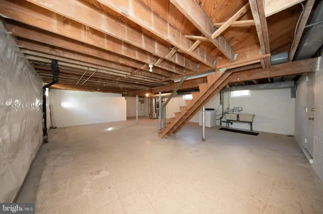 a view of a patio with couches chairs and wooden fence
