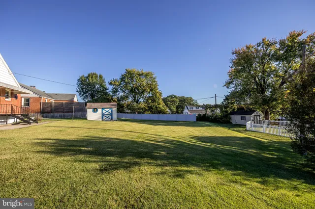 a view of a swimming pool with an outdoor space and seating area