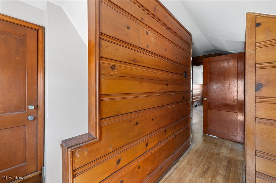 18122 Nottingham Road Cleveland, OH 44119 - Photo 22 of 29 Corridor with light wood finished floors and vaulted ceiling