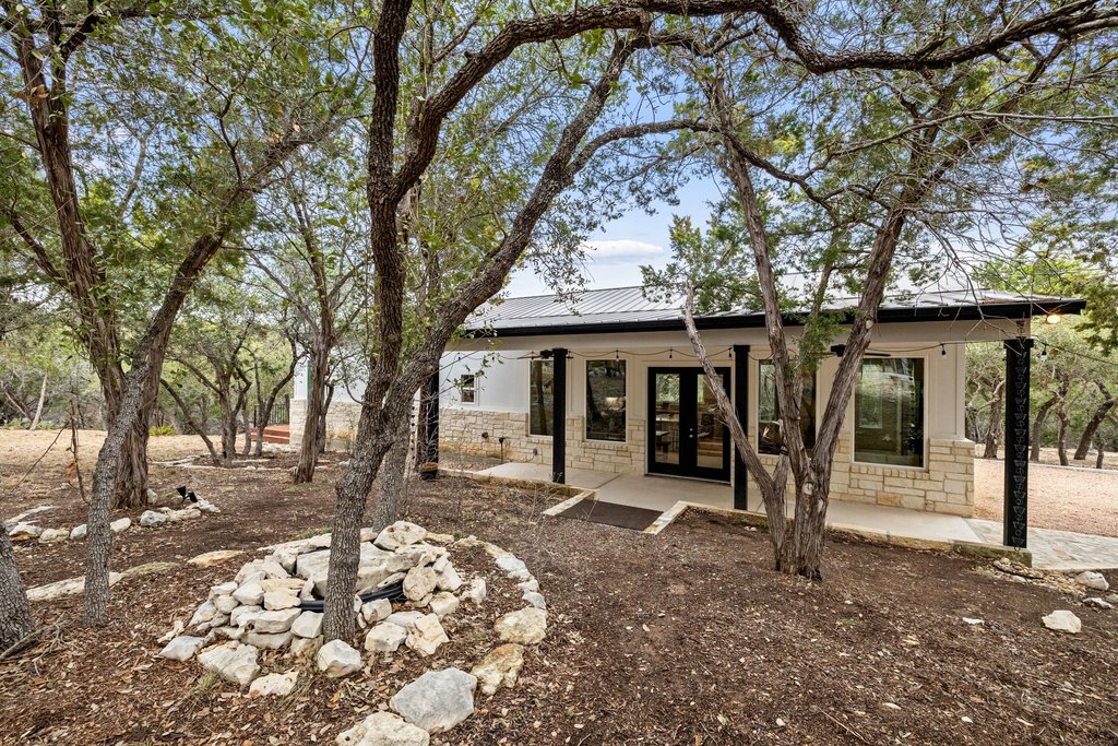 4018 Bee Creek Road Spicewood, TX 78669 - Photo 34 of 40 Detached guest house offering approximately 1,533 sqft w/ 2 BDR 2 Ba, full kitchen, living and dining spaces.
