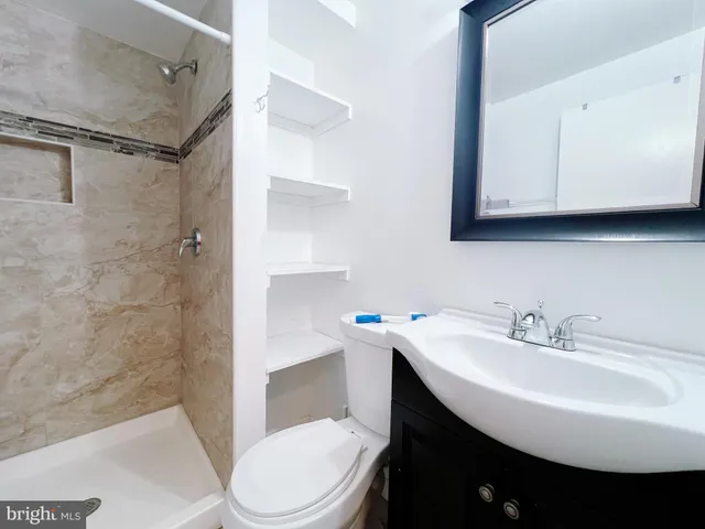 a kitchen with refrigerator and sink