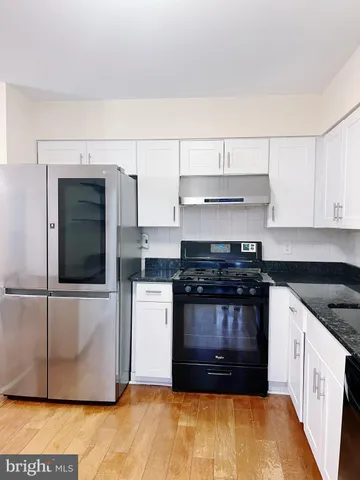 a bathroom with a sink a toilet and vanity