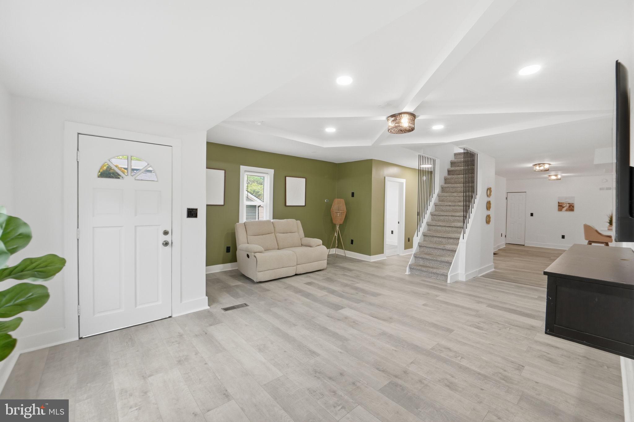 5906 Berwyn Road College Park, MD 20740 - Photo 4 of 46 a living room with furniture and a wooden floor