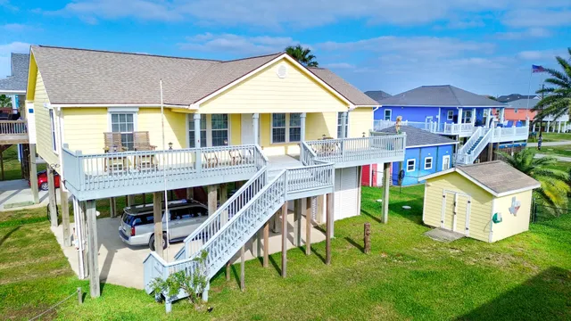a view of an house with backyard porch and sitting area