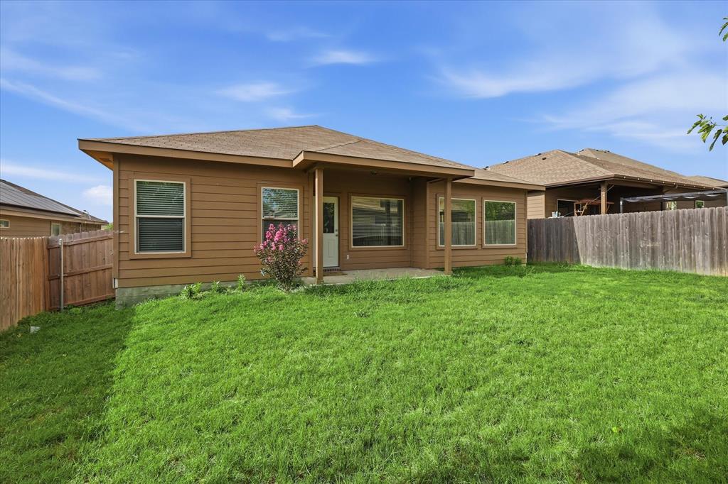 720 Rio Bravo Drive Fort Worth, TX 76052 - Photo 33 of 38 Expansive backyard with a covered patio and mature landscaping